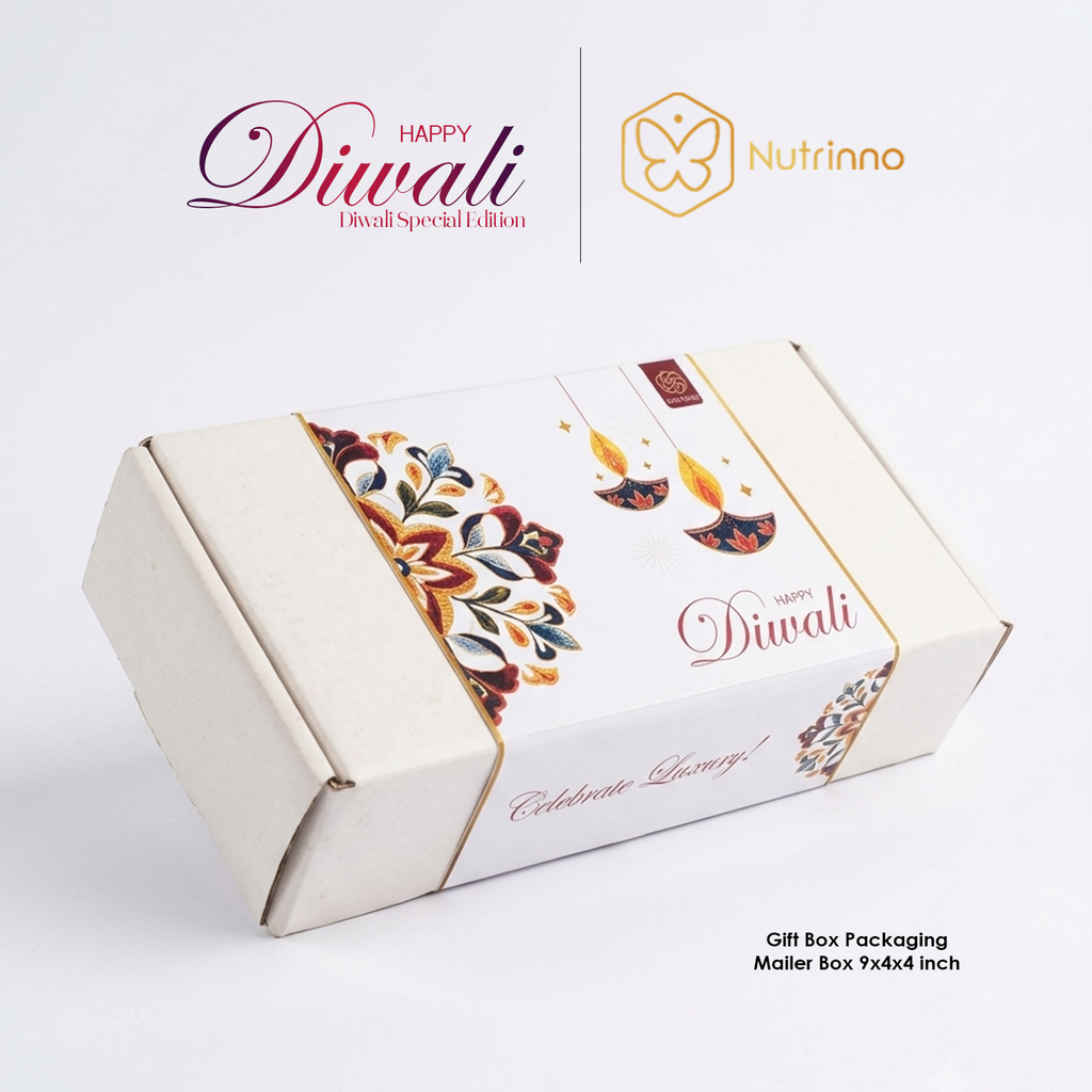 Diwali Mini Gift Hamper in a cream mailer box with a white festive sleeve, colorful floral motifs, and Diwali lettering.