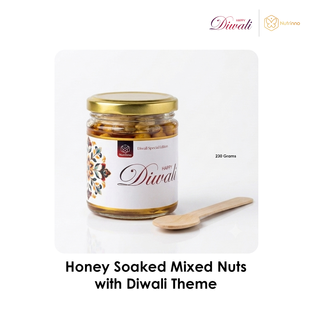 Diwali Premium Gift Hamper featuring a glass jar of honey-soaked mixed nuts with a gold lid and Diwali-themed label