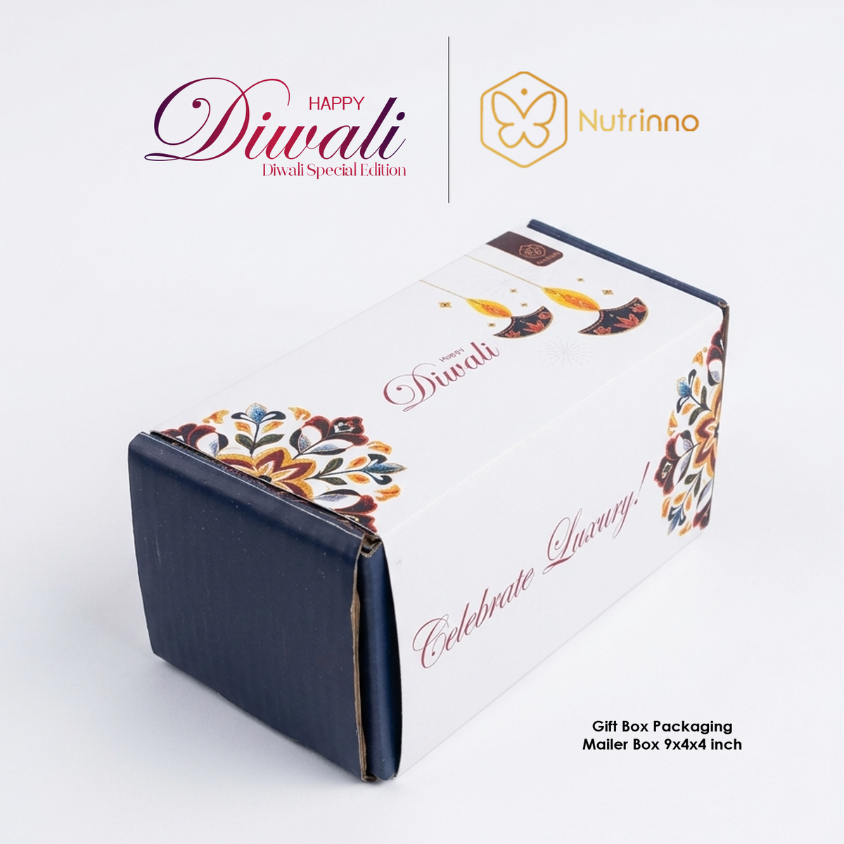 Diwali Premium Gift Hamper in a white rectangular gift box with navy ends, colorful floral motifs and festive lettering